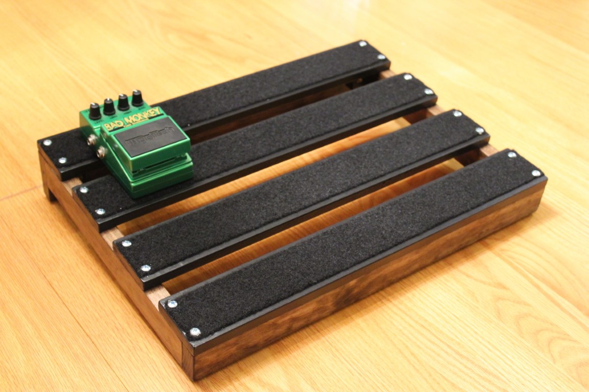 Angle view of the 18x13inch Underglowed handmade PedalBoard with bad monkey pedal