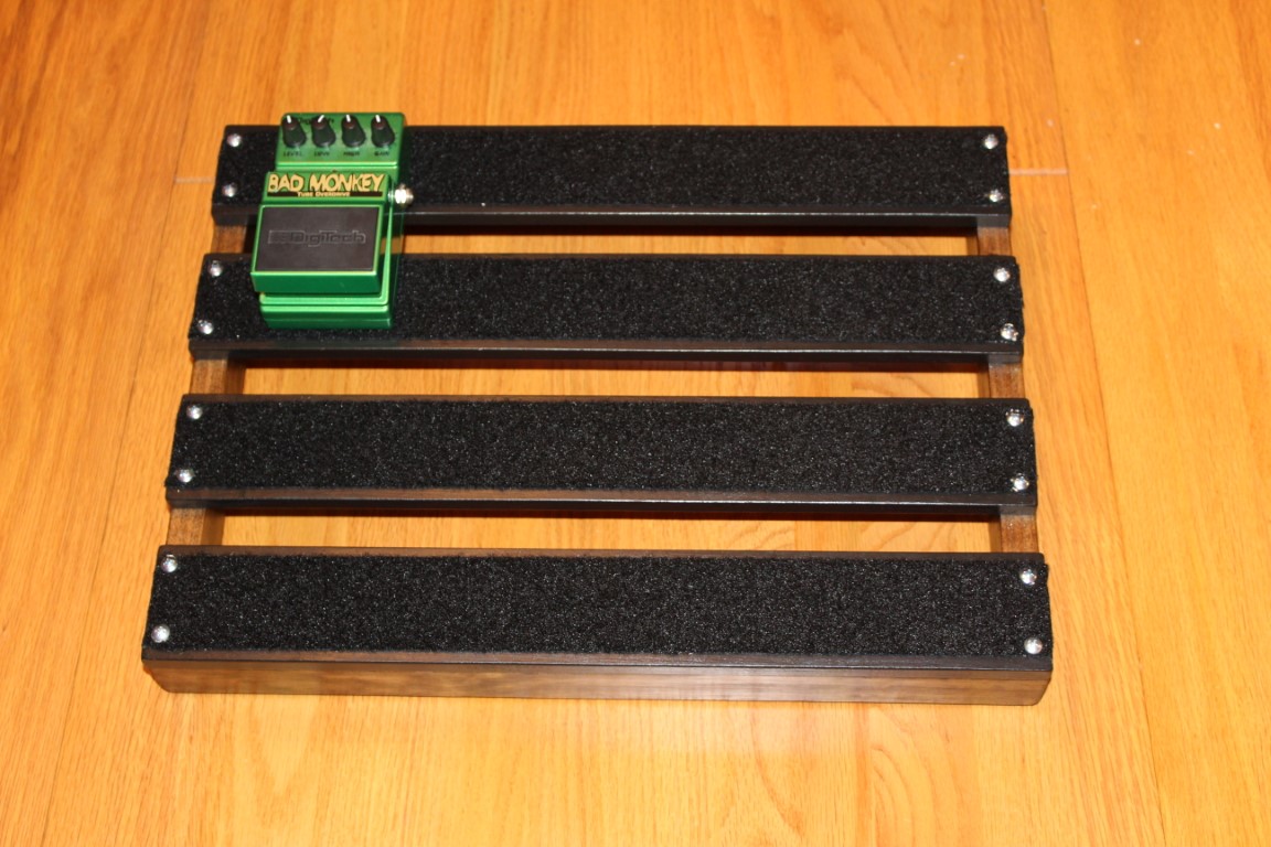 Top view of the 18x13inch Underglowed handmade PedalBoard with bad monkey pedal