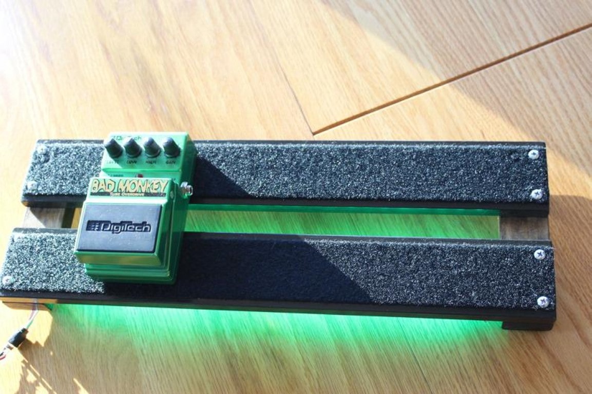 Top view of the Under-Glowed 18x6inch PedalBoard with a Bad monkey pedal