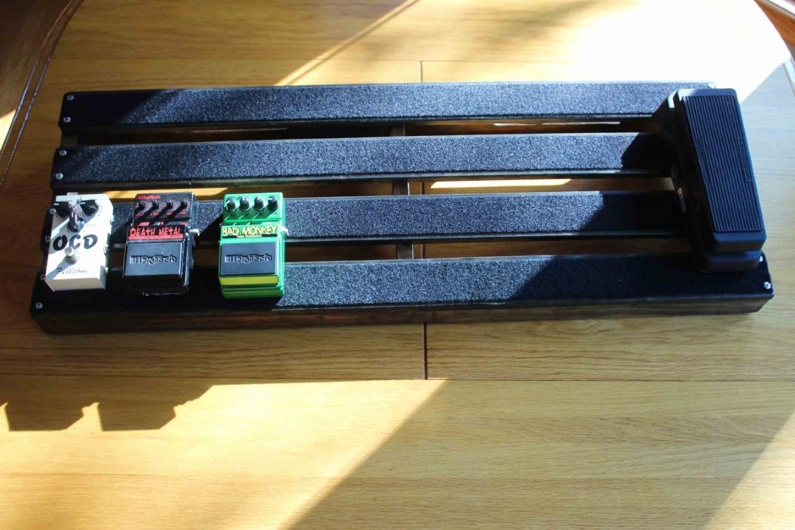 Top view of the 36x13inch Premium Hand Made Pedalboard with three guitar pedals
